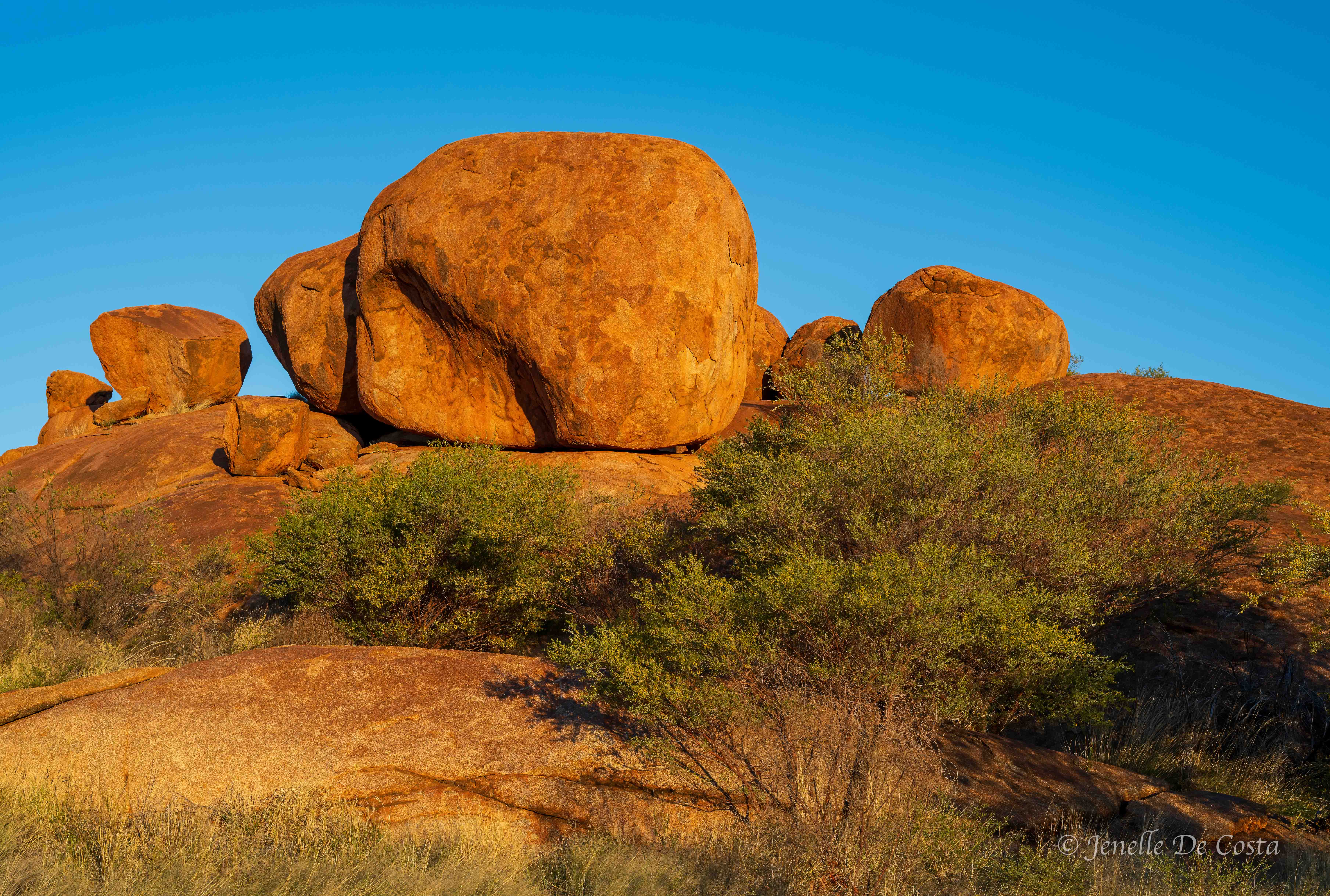 The rock glow in the early morning light. Karlu Karlu.
